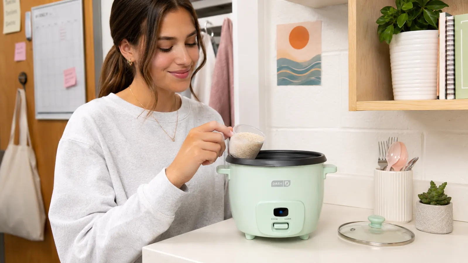 Steam rising from the Dash Mini Rice Cooker vent hole during cooking